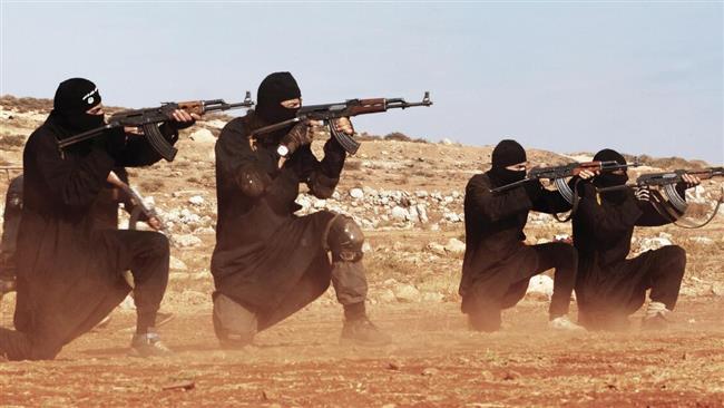 The file photo shows Daesh terrorists in an unknown location.
