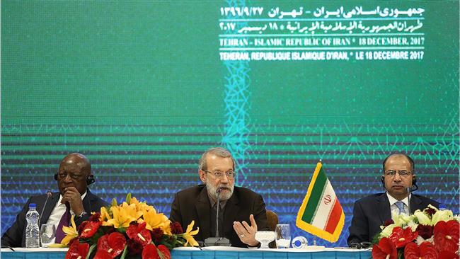 Iran’s Parliament Speaker Ali Larijani (C) speaks to reporters following the Meeting of the PUIC Presidential Troika in the Iranian capital Tehran on December 18, 2017. (Photo by ICANA)