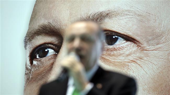 Backdropped by a poster of himself, Turkey’s President Recep Tayyip Erdogan delivers a speech to supporters of his ruling Justice and Development Party, during a rally in Mus, eastern Turkey, on December 3, 2017. (Photo by The Associated Press)