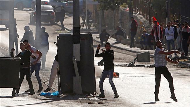 Palestinian protesters throw stones at Israeli forces during clashes in the occupied West Bank on December 16, 2017. (Photo by AFP)