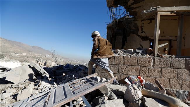 A man walks past a destroyed house at the site of Saudi airstrikes in Sana’a, Yemen, on December 26, 2017. (Photo by Reuters)