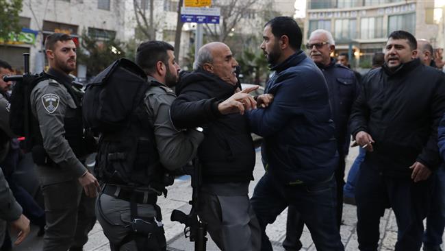 Israeli forces restrain a Palestinian protester during a small protest in East Jerusalem al-Quds on December 30, 2017. (Photo by AFP)