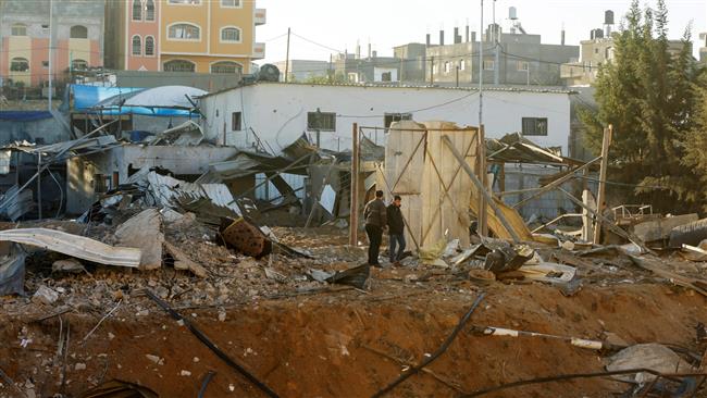 Palestinians look at the damage at a facility in the aftermath of an Israeli airstrike in the northern Gaza Strip, December 9, 2017. (Photo by AFP)