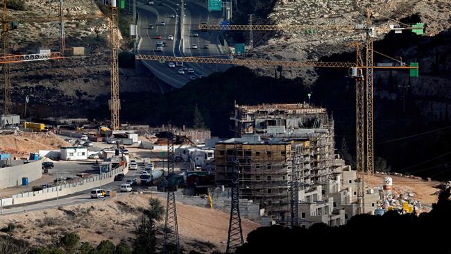 Cranes work on new constructions in the Israeli settlement of Ramot, a neighborhood of the occupied East Jerusalem al-Quds, December 14, 2017. (AFP photo)