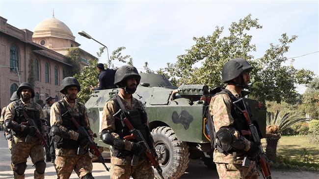 Pakistani soldiers are seen at the premises of an Agriculture Training Institute after an attack by Taliban militants in Peshawar on December 1, 2017. (Photo by AFP)