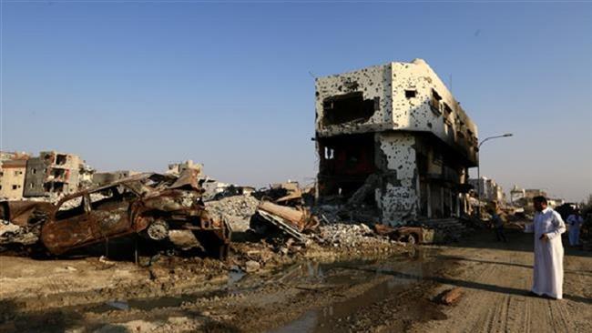 A member of the media takes pictures of an area destroyed by Saudi Security forces in Awamiyah on August 9, 2017. (File photo)