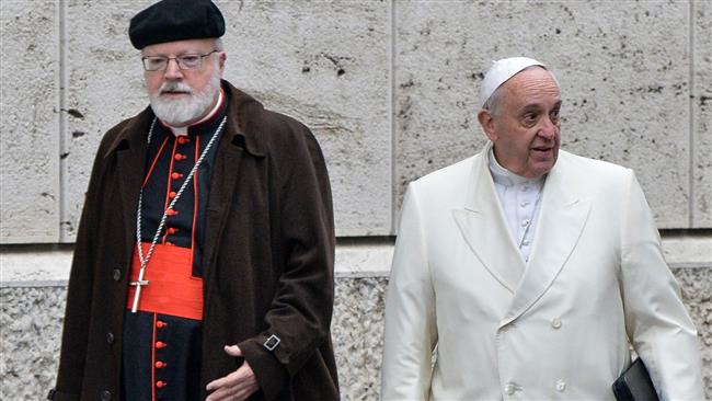This file photo, taken on February 13, 2015, shows Pope Francis (R) and US Cardinal Sean Patrick O’Malley as they arrive to take part with cardinals and bishops in the Papal consistory before the nominations of new cardinals, at the Vatican. (By AFP)