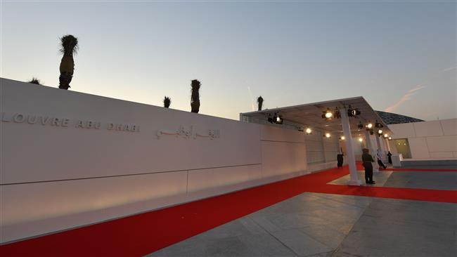 Security staffers stand at the entrance to the Louvre Abu Dhabi prior to the inauguration of the museum, in the Emirates, on November 8, 2017. (Photo by AFP)