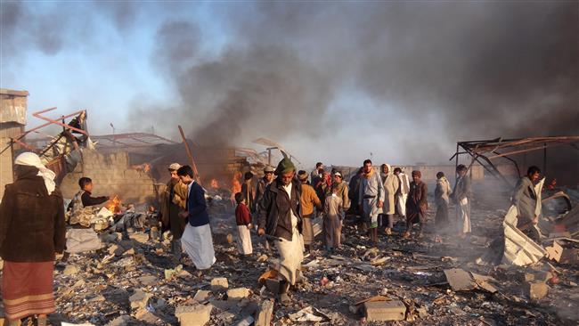 Smoke rises as Yemenis inspect the damage at the site of airstrikes in the northwestern city of Sa’ada, January 6, 2018. (Photo by AFP)