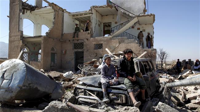 This file photo taken on November 14, 2016 shows children sitting amidst the rubble of a house hit by Saudi air strikes two days earlier on the outskirts of the Yemeni capital Sana’a. (AFP photo)