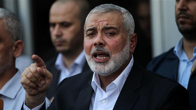 Hamas Chief Ismail Haniyeh speaks to the press on the Palestinian side of the Rafah border crossing in the southern Gaza Strip on September 19, 2017. (AFP photo)