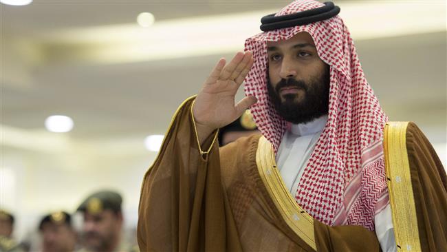 The handout picture provided by the Saudi Royal Palace on August 23, 2017 shows Saudi Crown Prince Mohammed bin Salman attending a military parade by security forces in the holy city of Mecca. (Via AFP)