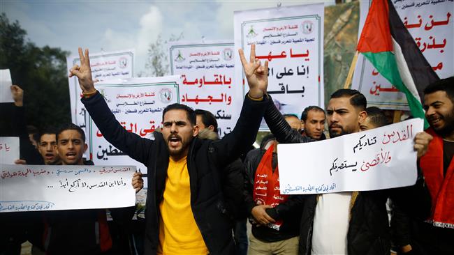 Palestinian students take part in a protest in Gaza City on January 23, 2018 against the US and Israel. (Photo by AFP)
