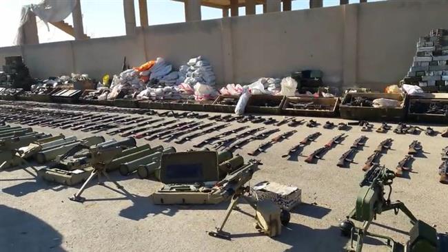 This picture shows a cache of weapons and chemical materials seized by Syrian government forces from Daesh Takfiri terrorists in the country’s eastern province of Dayr al-Zawr on December 9, 2017. (Photo by SANA)