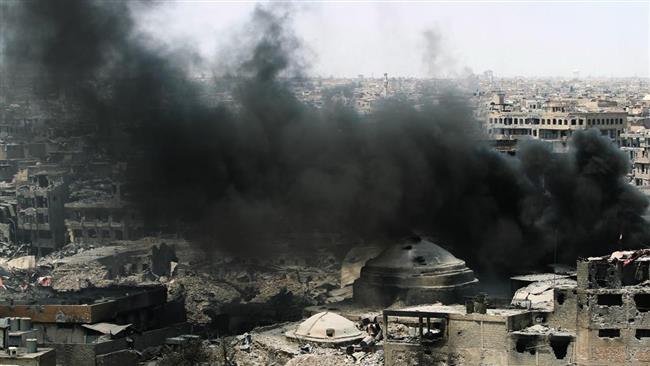 A picture taken on July 9, 2017, shows smoke billowing following an airstrike by US-led coalition forces allegedly targeting the Daesh terror group in Mosul, Iraq. (Getty Images)
