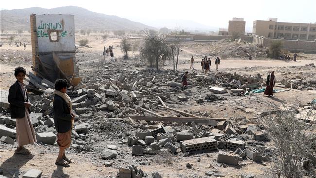 People gather at the site of a Saudi airstrike on the outskirts of the city of Sa