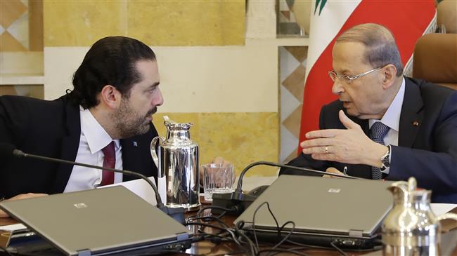 Lebanese President Michel Aoun (R) and Prime Minister Saad Hariri attend a cabinet meeting at the presidential palace of Baabda, east of the capital Beirut, on December 5, 2017. (Photo by AFP)