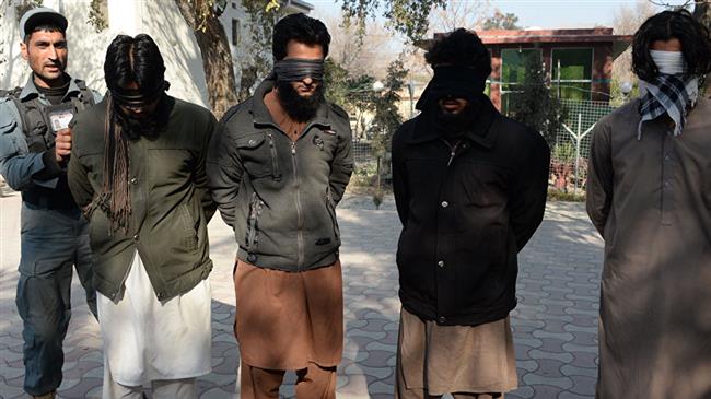 In this file photo, Daesh militants stand handcuffed while being presented to the media at a police headquarter in Jalalabad, eastern Afghanistan. (Photo by AFP)