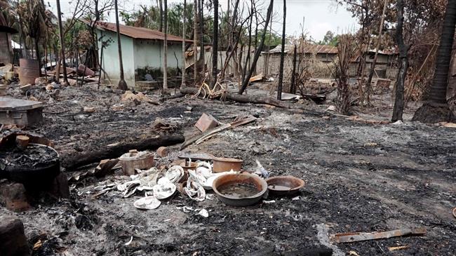 Broken dishes can be seen in the burned out remains of a house in Myo Thu Gyi village where houses were burnt to the ground near Maungdaw town in Rakhine state on August 31, 2017. (Photo by AFP)