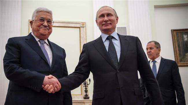 Russian President Vladimir Putin (R) shakes hands with Palestinian leader Mahmud Abbas during their meeting at the Kremlin in Moscow on February 12, 2018. (Photo by AFP)