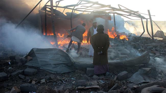 Smoke rises as Yemenis inspect the damage at the site of Saudi airstrikes in the northwestern city of Sa’ada, January 6, 2018. (Photo by AFP)