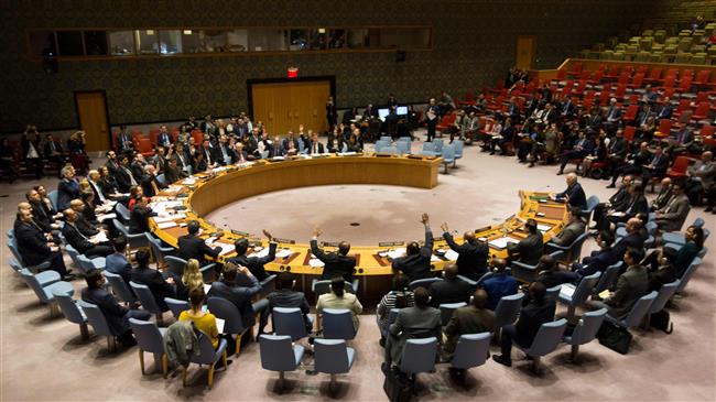 Members of the UN Security Council vote during a meeting on a ceasefire in Syria February 24, 2018 in New York. (Photo by AFP)