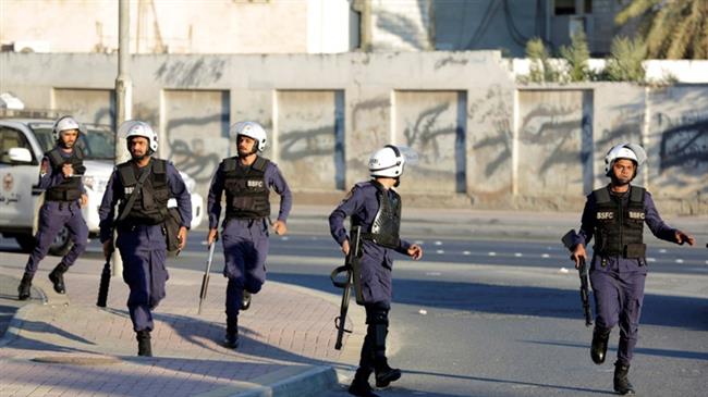 Bahraini police run toward protesters to disperse an anti-government march in Daih, Bahrain, February 13, 2016. (Photo by AP)