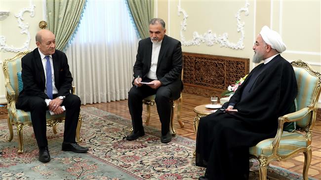 Iranian President Hassan Rouhani (R) and French Foreign Minister Jean-Yves Le Drian meet in Tehran on March 5, 2018. (Photo by president.ir)