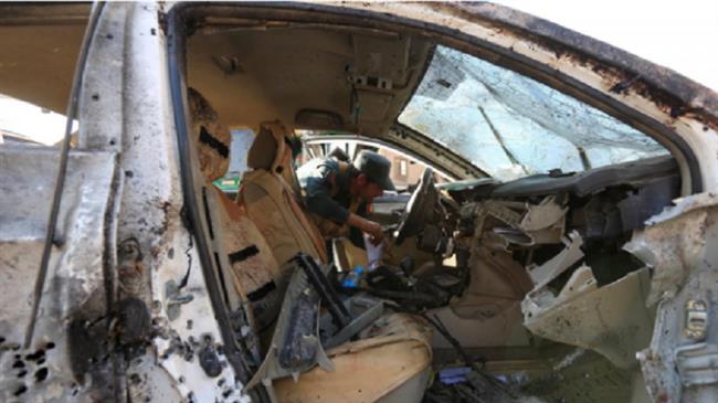 A member of Afghan security forces inspects a vehicle at the site of an attack in Jalalabad, March 7, 2018. (Photo by Reuters)
