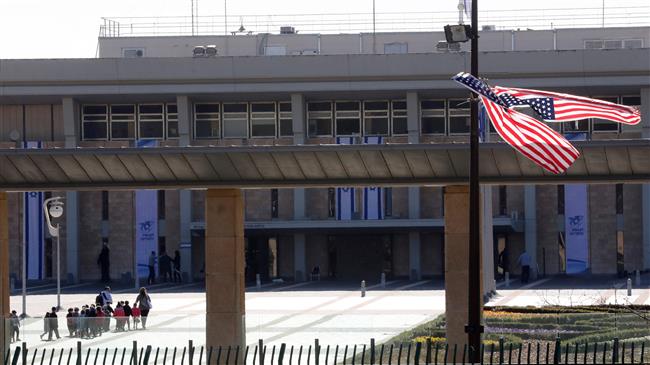 File photo of American flags placed outside the Knesset building in Jerusalem al-Quds on January 21, 2018 (Photo by AFP)