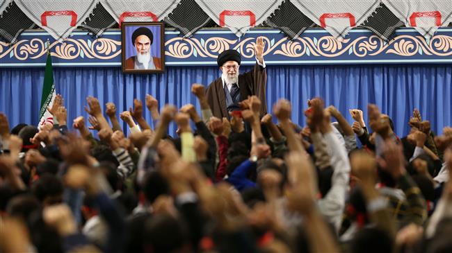 Leader of the Islamic Revolution Ayatollah Seyyed Ali Khamenei waves at a group of teenagers and youths during a meeting in Tehran on March 10, 2018. (Photo by Leader.ir)