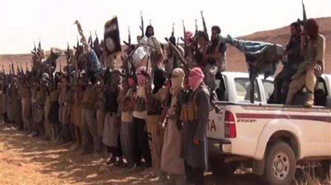 This file photo shows Daesh Takfiri militants at an undisclosed location in Iraq.