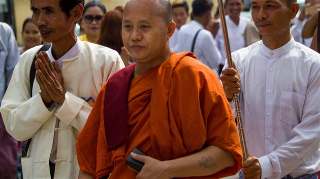 Myanmar’s hawkish monk Wirathu (C) arrives at a monastery to give a public speech, in Yangon, Myanmar, March 10, 2018. (Photo by AFP)