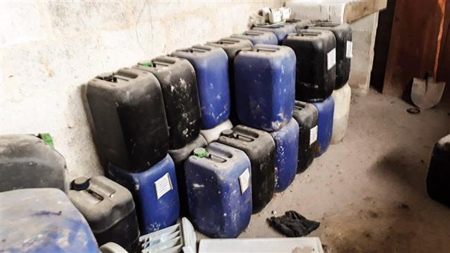Plastic jerry cans full of different chemicals are seen in a secret workshop run by militants prior to their defeat in al-Shefounieh town, Syria’s Eastern Ghouta, on March 12, 2018. (Photos by SANA)
