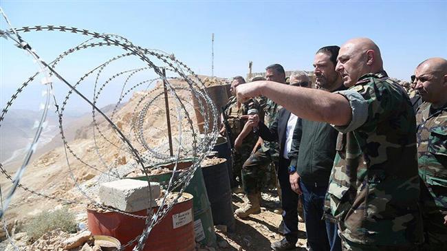 Lebanese Prime Minister Saad Hariri visits border areas along with army commanders in August 2017.