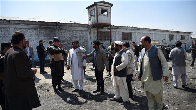 Afghan security personnel inspect the site of a car bomb attack in Kabul on March 17, 2018. (Photo by AFP)