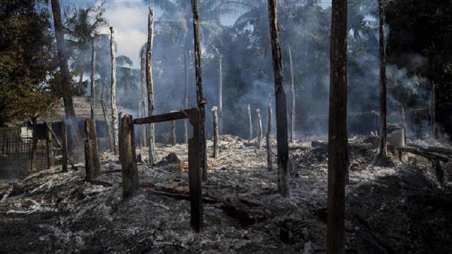 In this photograph, taken on October 14, 2016, debris of burned houses is seen in Warpait village, Rakhine state, Myanmar (By AFP)