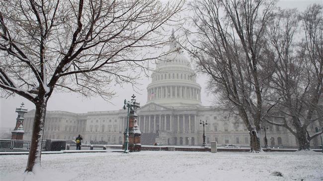 Snow falls at the US Capitol during a snow storm in Washington, DC, March 21, 2018. (AFP photo)