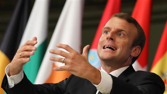French President Emmanuel Macron gestures as he delivers a speech on the European Union in the amphitheater of the Sorbonne University in Paris on September 26, 2017. (Photo by AFP)