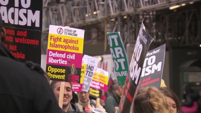 Anti-racist activists march against Islamophobia during a counter protest in Birminham, England on Saturday, March 24, 2018.