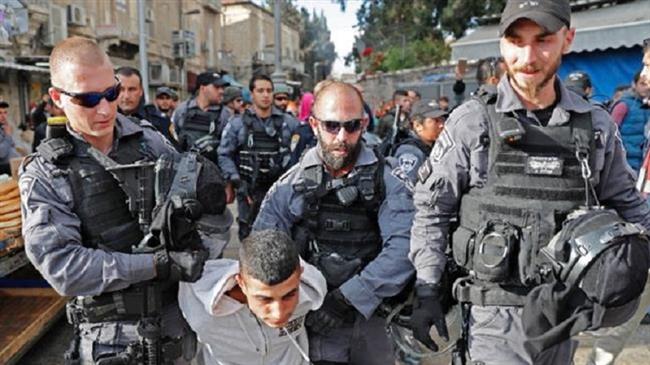 The file photo shows Israeli forces detaining a Palestinian youth in the occupied Old City of Jerusalem al-Quds. (Photo by AFP)