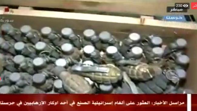 This picture shows a cache of Israeli-made weapons found inside a secret underground in the Syrian town of Harasta, Eastern Ghouta region, on March 28, 2018. (Photo by Syria’s state-run television network)