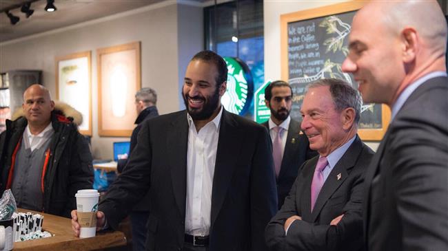 A handout picture provided by the Saudi Royal Palace on March 28, 2018, shows Saudi Crown Prince Mohammed bin Salman (C) ordering coffee with former New York mayor Michael Bloomberg (2nd-R) at a coffee shop in New York, the United States.