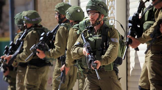 Israeli soldiers take positions during a clash with Palestinian protesters in the occupied West Bank city of al-Khalil (Hebron) on March 31, 2018. (Photo by Xinhua news agency)