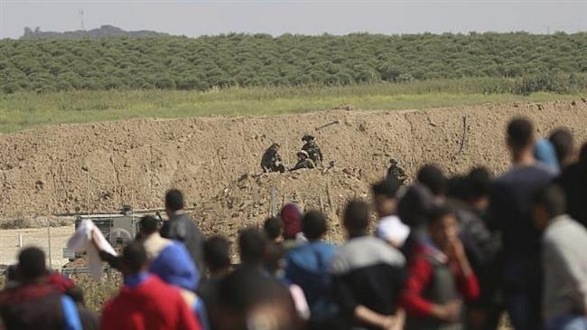 Palestinians gather during a protest near the Gaza fence in eastern Gaza City, March 31, 2018. (Photo by AP)