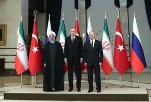 Iranian President Hassan Rouhani (L), Turkish President Recep Tayyip Erdogan (C) and Russian President Vladimir Putin pose for a photo ahead of the Turkey-Russia-Iran tripartite summit in Ankara, Turkey, on April 04, 2018. (Photo by president.ir)