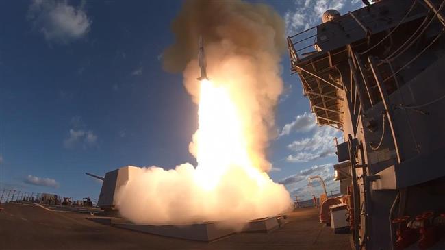 This US Navy photo obtained on April 7, 2018 shows the Arleigh Burke-class guided-missile destroyer USS Winston S. Churchill as it fires a Standard Missile (SM) 2 from the forward missile deck the day before in the Atlantic Ocean. (Photo by AFP)