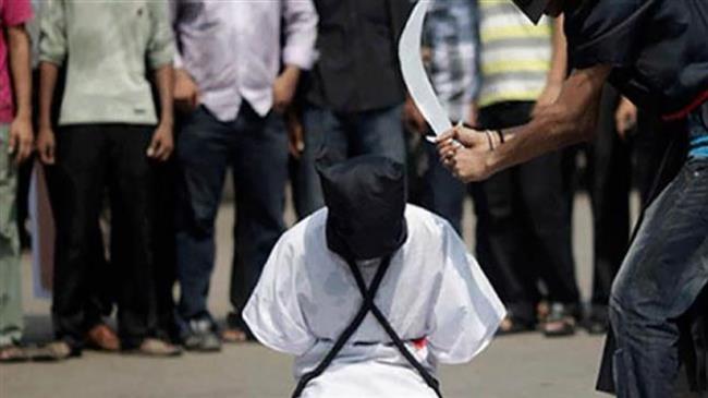 Protesters of the beheading of foreign workers in Saudi Arabia stage a mock beheading. (File photo)