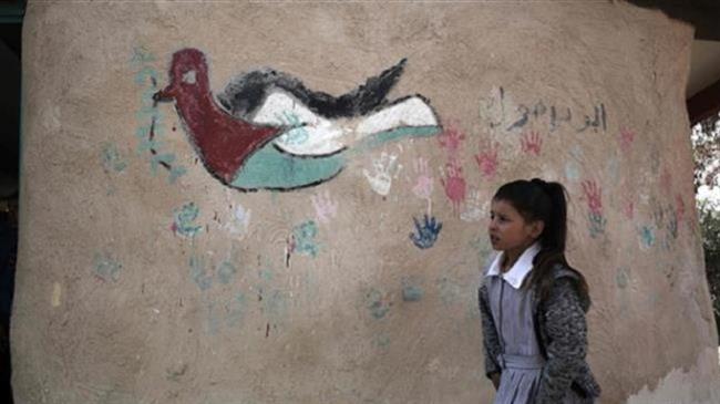 A Palestinian girl walks at her school in the village of Khan al-Ahmar in the Israeli-occupied West Bank on February 23, 2017. (Photo by AFP)