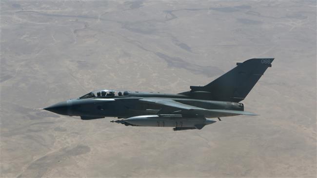 A British Royal Air Force Tornado fighter jet flies over central Iraq, September 21, 2016. (Photo by AFP)